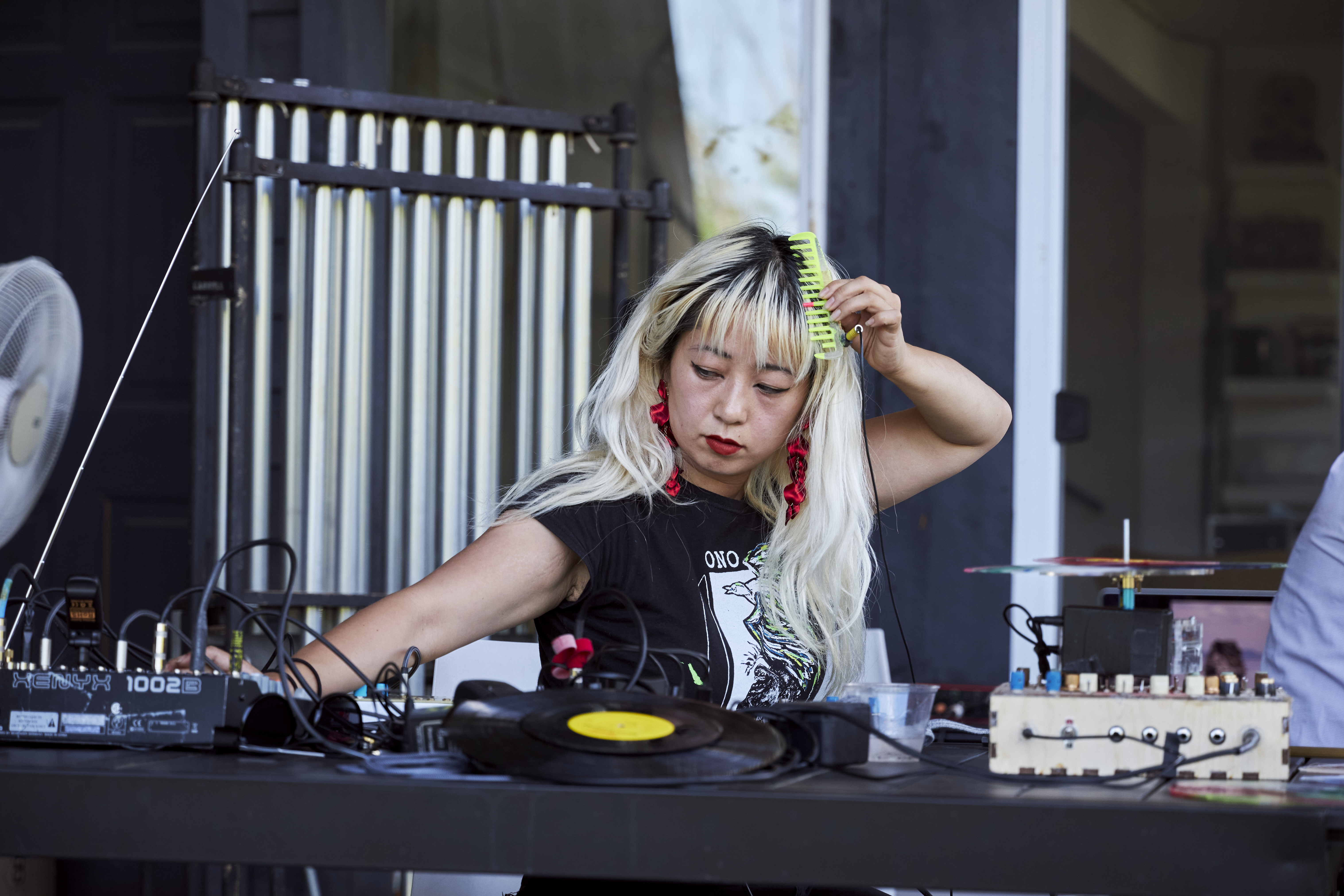 Victoria Shen performs with a comb during Upstate Art Weekend