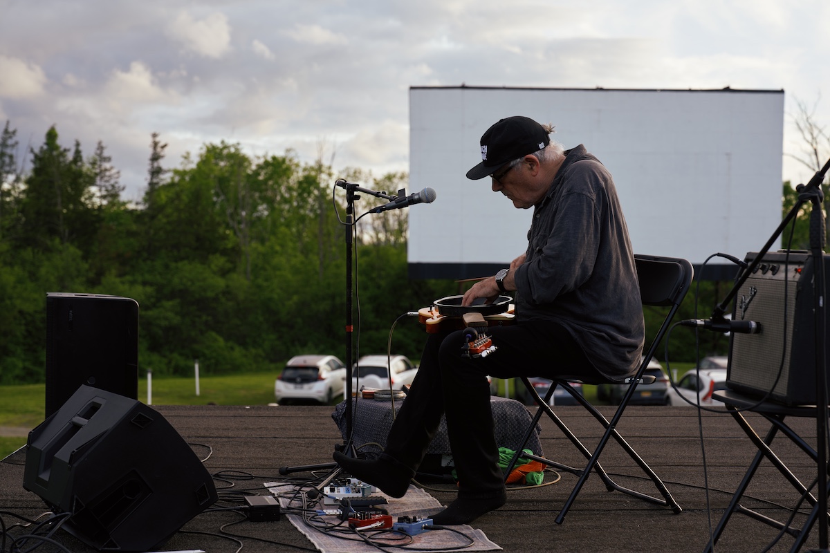 Fred Frith performing at Eno on 4 Screens event at the Hi-Way Drive-In